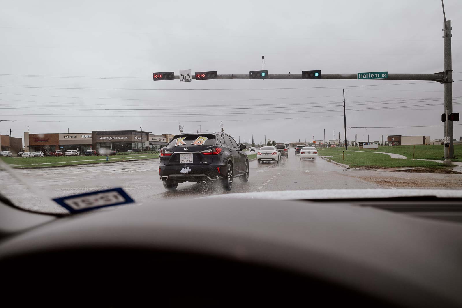 A Rain soaked wedding day capturing the car taking the bride and groom to Briscoe manor