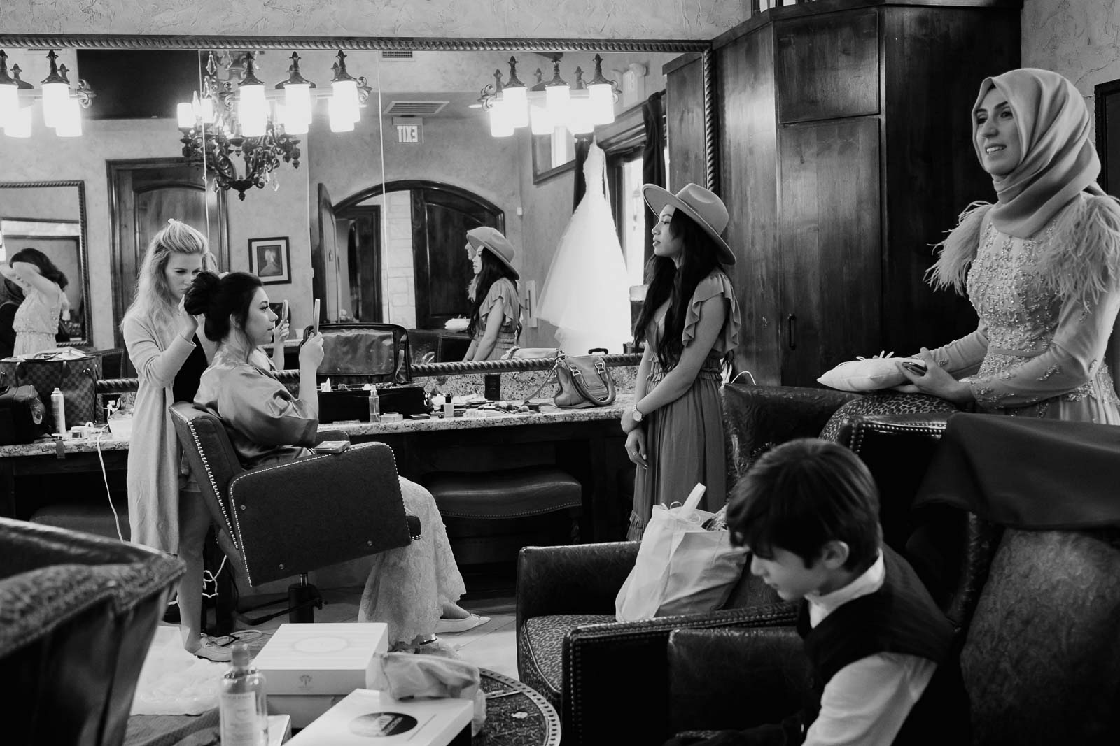 A wide shot of the friends and family of the bride at the Briscoe Manor in the mirror at Briscoe manner