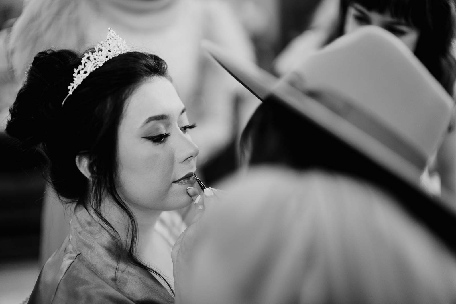 Lipstick is applied to the brides lips