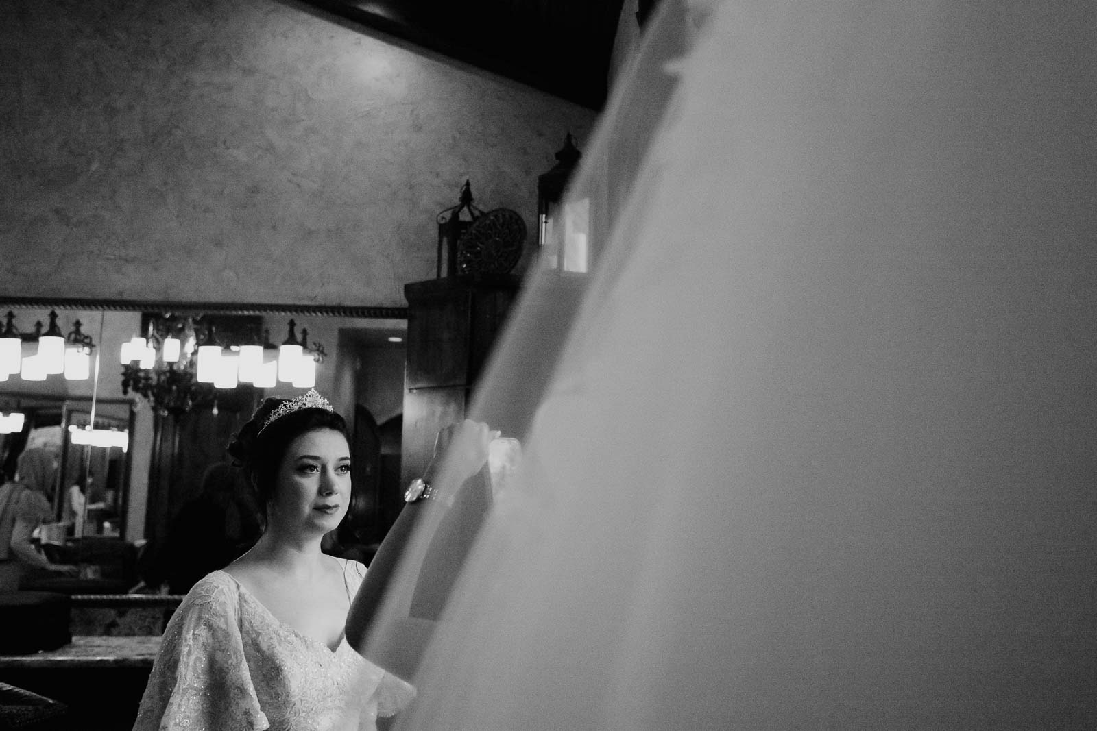 The bride looks up to her weil at  Briscoe Manor