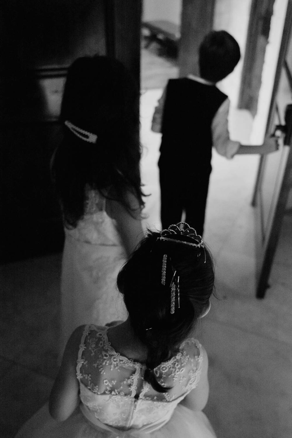 geometric patterns in a beautiful image taken from behind the flower girl and ring bearer