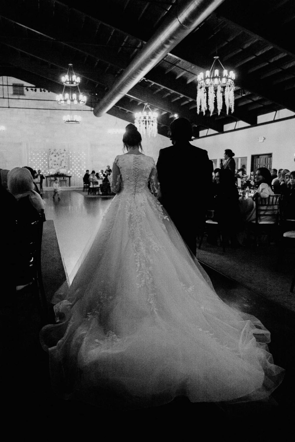 The bride and groom enter the wedding reception 