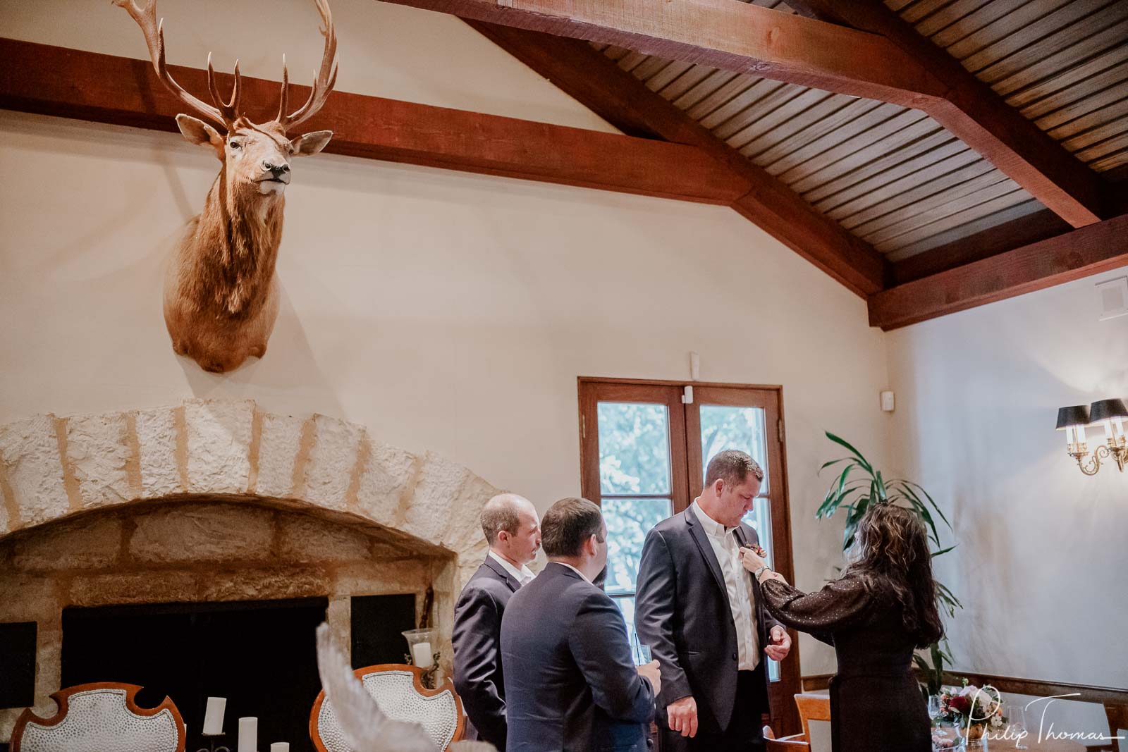 The groom has  boutonniere added that matches the style or color of the bridal bouquet.Club Giraud Wedding Reception San Antonio weddings Philip Thomas Photography