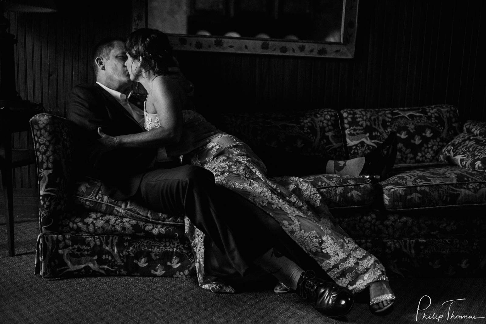 A posed image of couple lying on sofa atClub Giraud Wedding Reception San Antonio weddings Philip Thomas Photography
