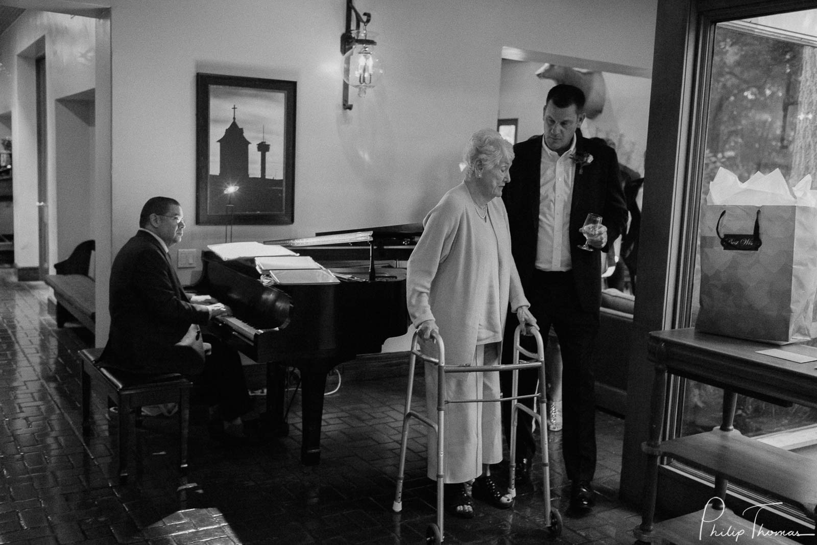 Son escorts mothers to the ceremony Club Giraud Wedding Reception San Antonio weddings Philip Thomas Photography