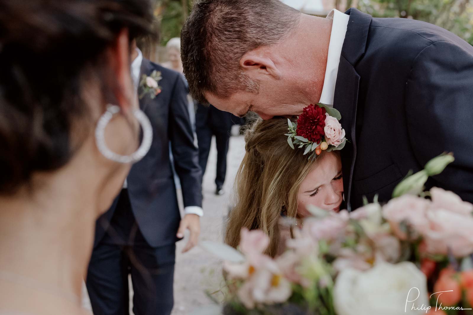 Father hugs his daughter weeping with joy  Club Giraud Wedding Reception San Antonio weddings Philip Thomas Photography