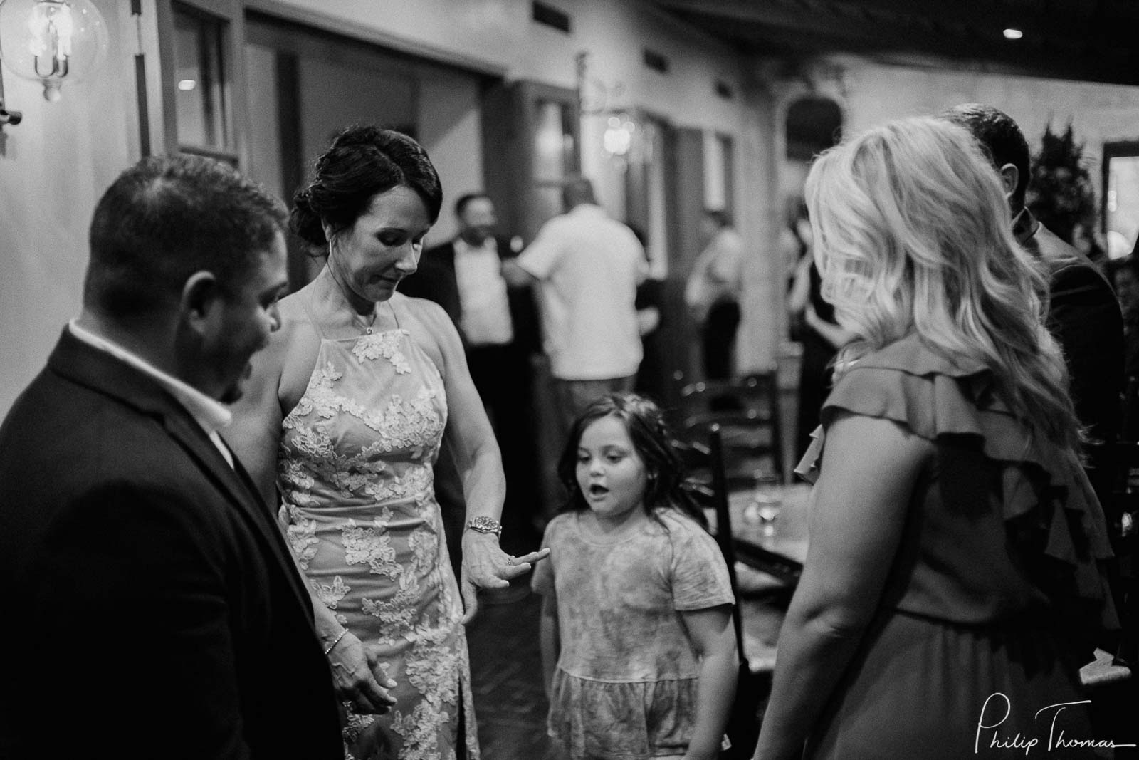 Kids expression reacting to ring on newlywed brides finger Club Giraud Wedding Reception San Antonio weddings Philip Thomas Photography