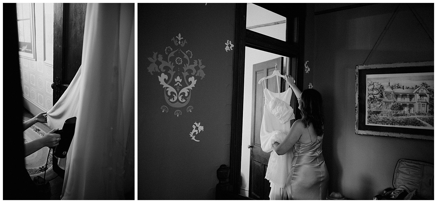 The brides dress is hung up on the door frame and steaming the dress at Barr Mansion