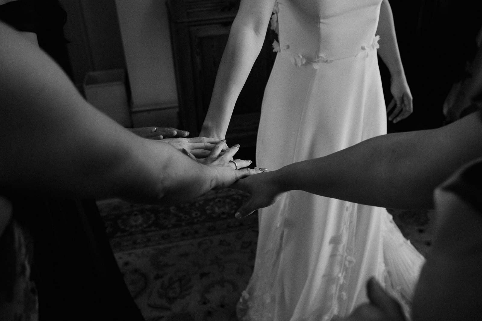 The girls and bride low five in a moment of solidarity