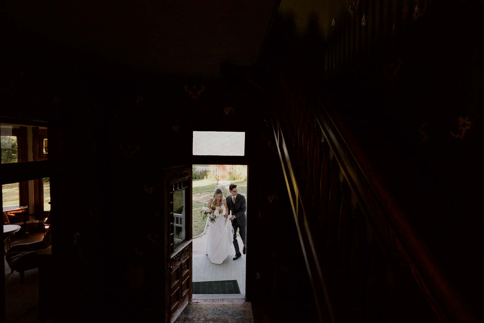 A series of three images as the just married couple enter the old house at Barr Mansion