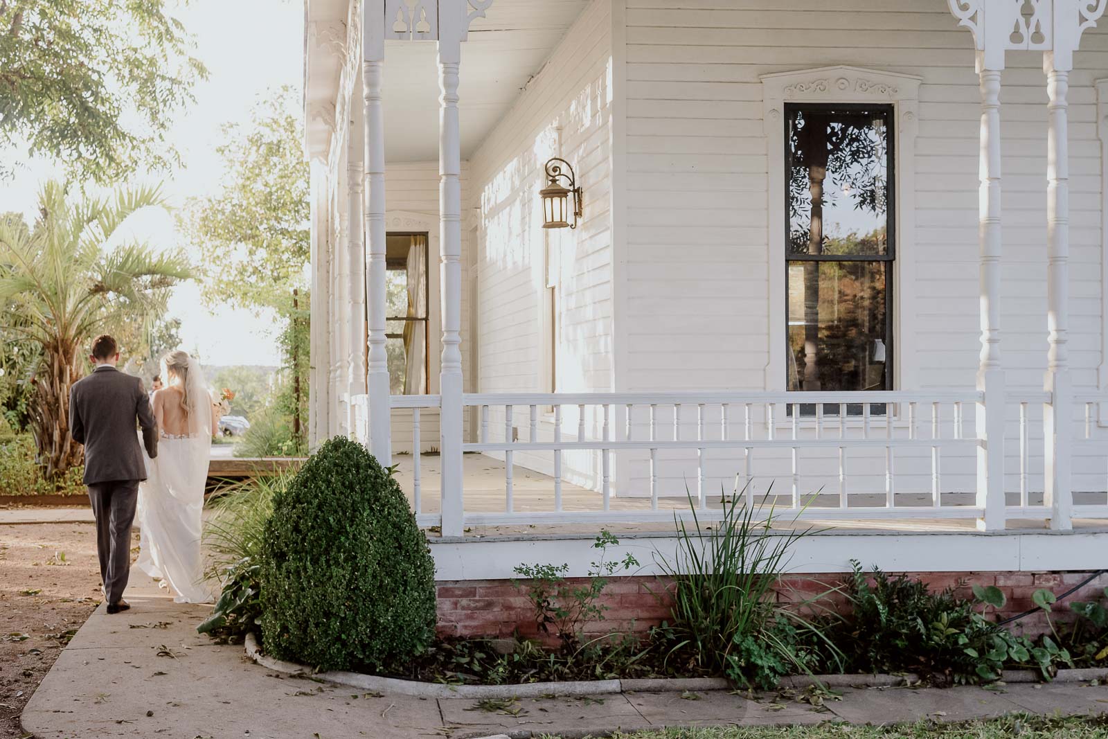 Caleb and Anna start their way toward the wedding guests at Barr Mansion outside Austin, Texas