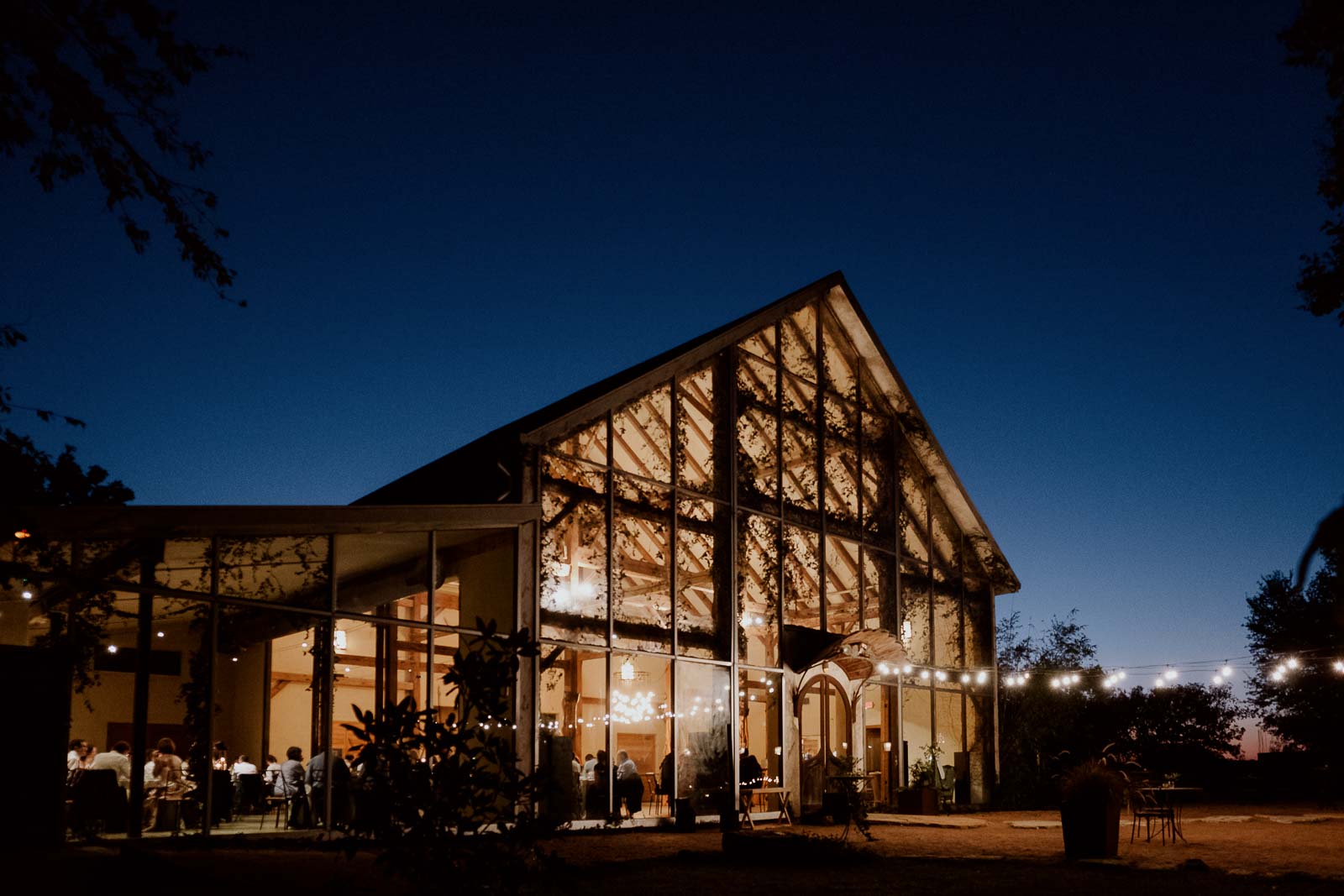 Barr Mansion glass ballroom photographed in the fall of 2022 at dusk