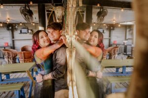 Couple reflected in mirror at La Grange in Houston