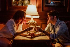 Cheers and a clink of glasses at Shay McElroy's Irish Pub for a couple's engagement session on a warm January day in Houston