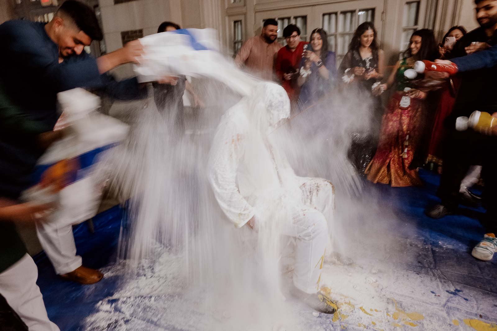 In modern times, the dirty pithi is a fun spin where the groom's family and friends throw food items, such as eggs, milk, flour, condiments, etc., to send him off to married life.