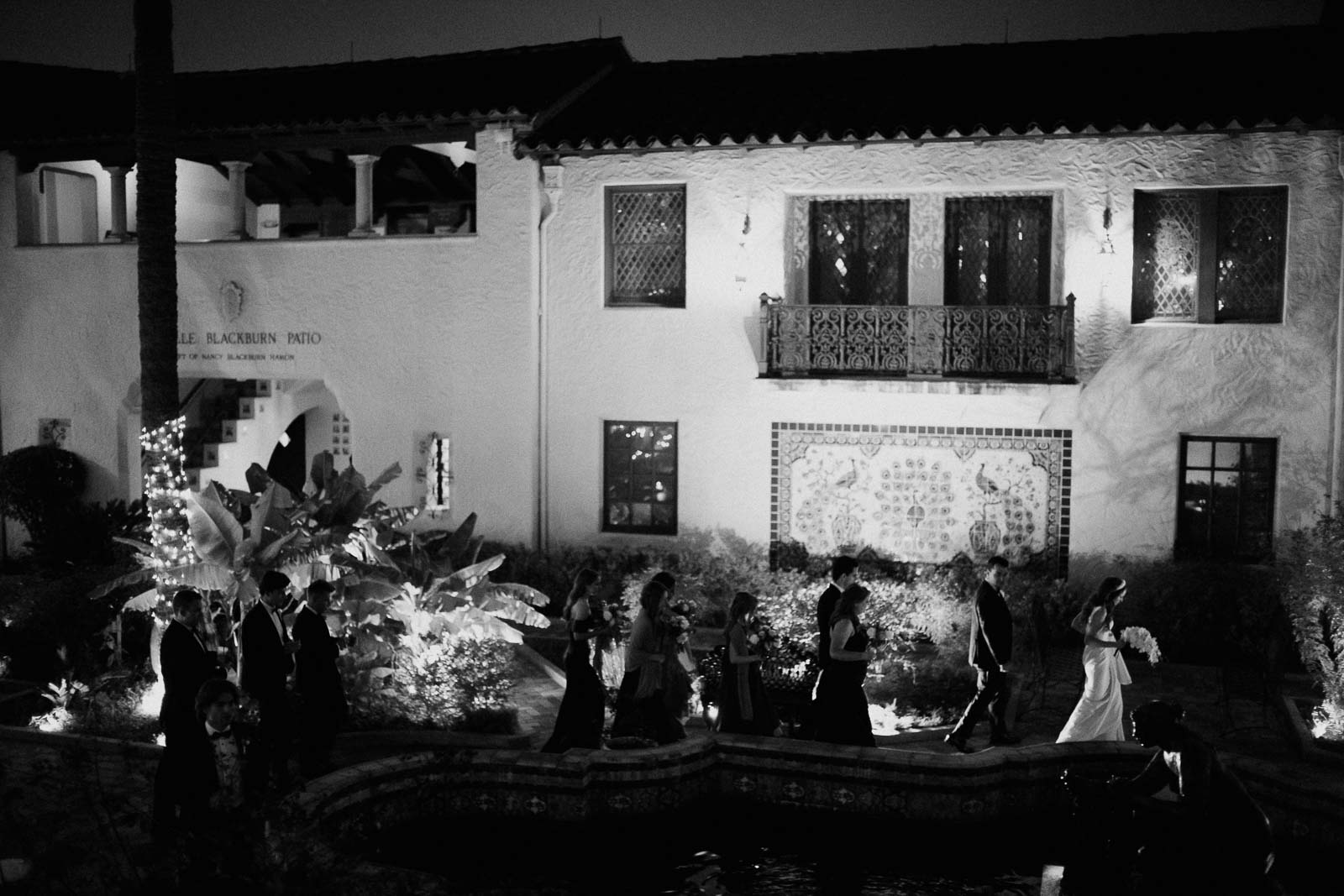 The wedding party makes their way through the courtyard of the McNay heading toward a reception