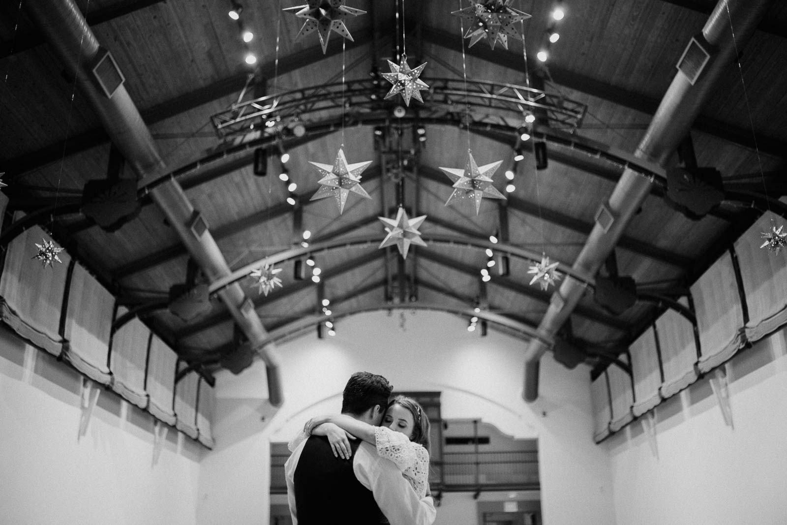Hanging decorative stars hang from the ceiling at the McNay as the couple embrace during the last dance