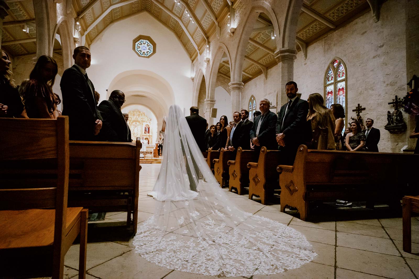 The bride escorted by her father down the aisle at San Fernando Cathedral