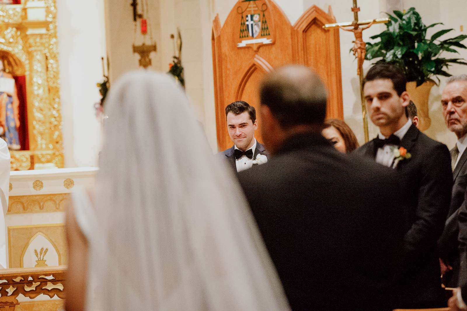 The groom catches his first glimpse of the bride down the aisle at a wedding ceremony in San Antonio Texas