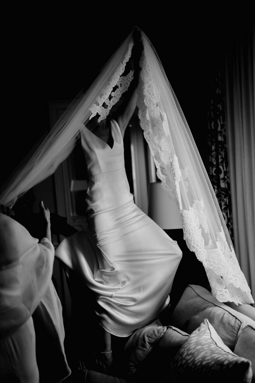 Bride sweeps the veil over her head at Home wedding Georgetown South Carolina Wedding photojournalist Philip Thomas Photography
