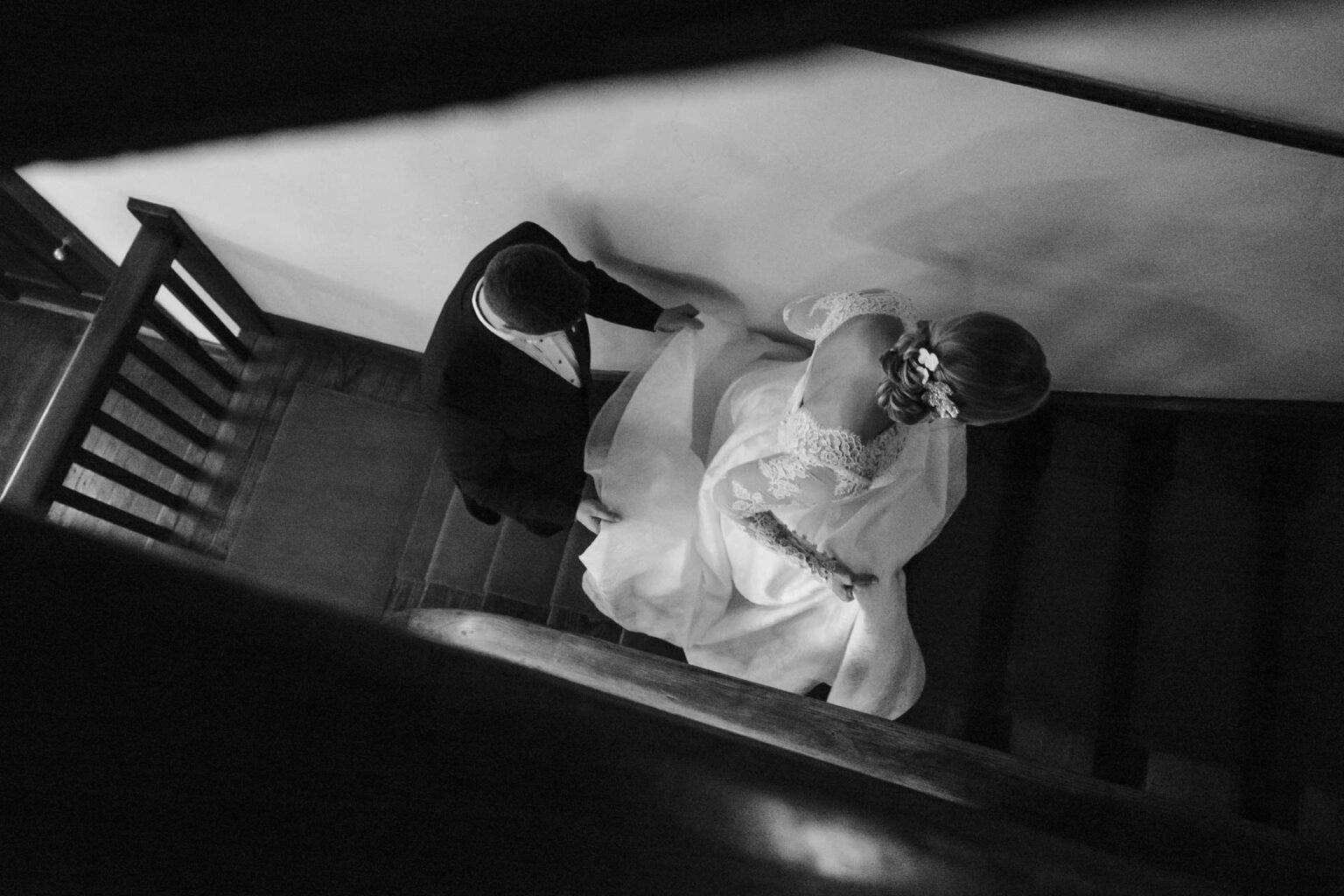 San Antonio wedding photographers Philip Thomas captures wedded couple ascending staircase at Hotel Havana - LM102788 2