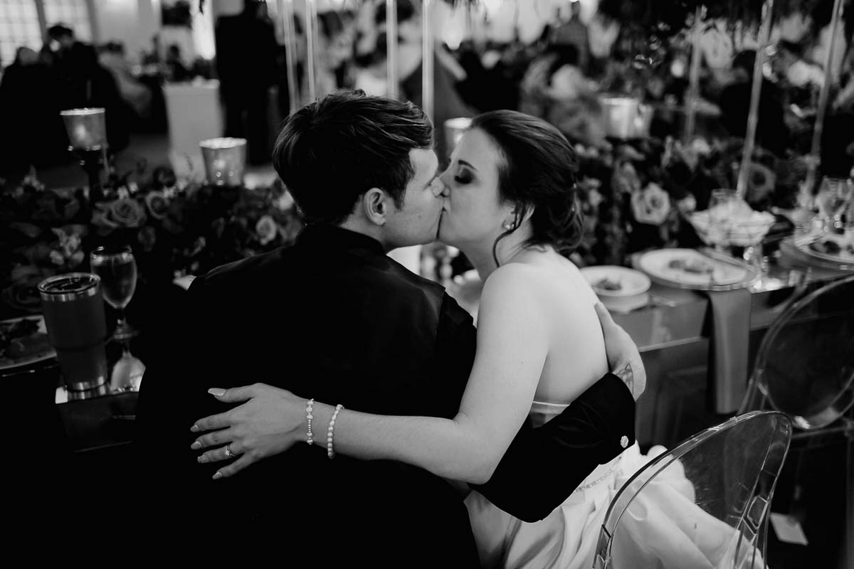 Ashley and Clayton steal a kiss at The Ballrom at Tanglewood in Houston Texas L1000596