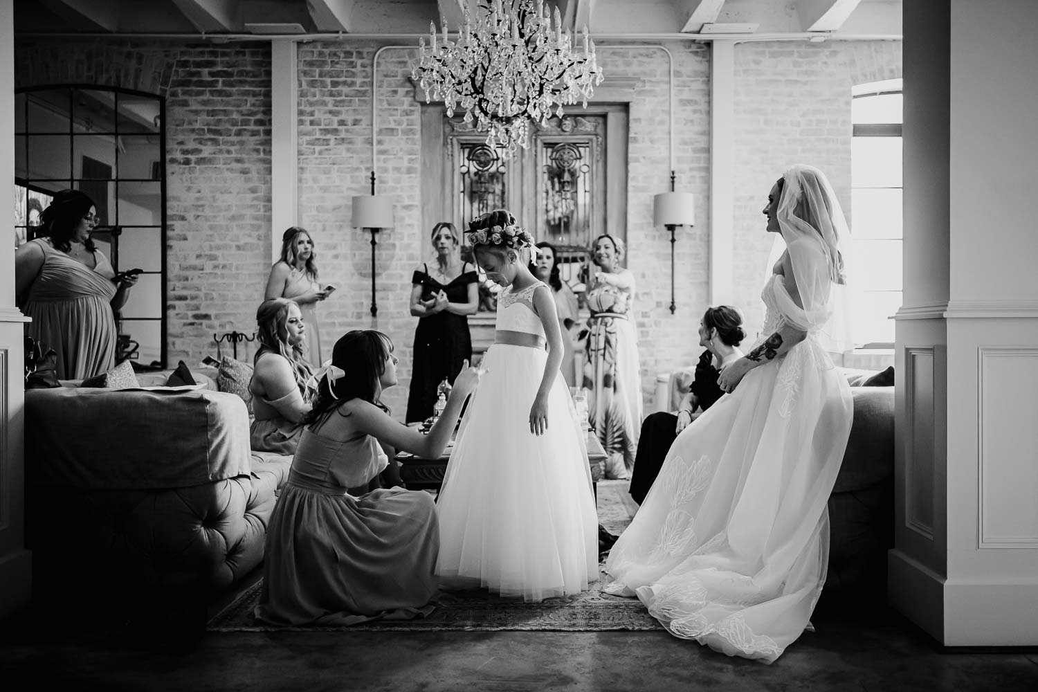 0261 L1004382A flower girl with the bride to the right and bridesmaids counter balancing the frame photographed at The Astorian, Houston, Texas