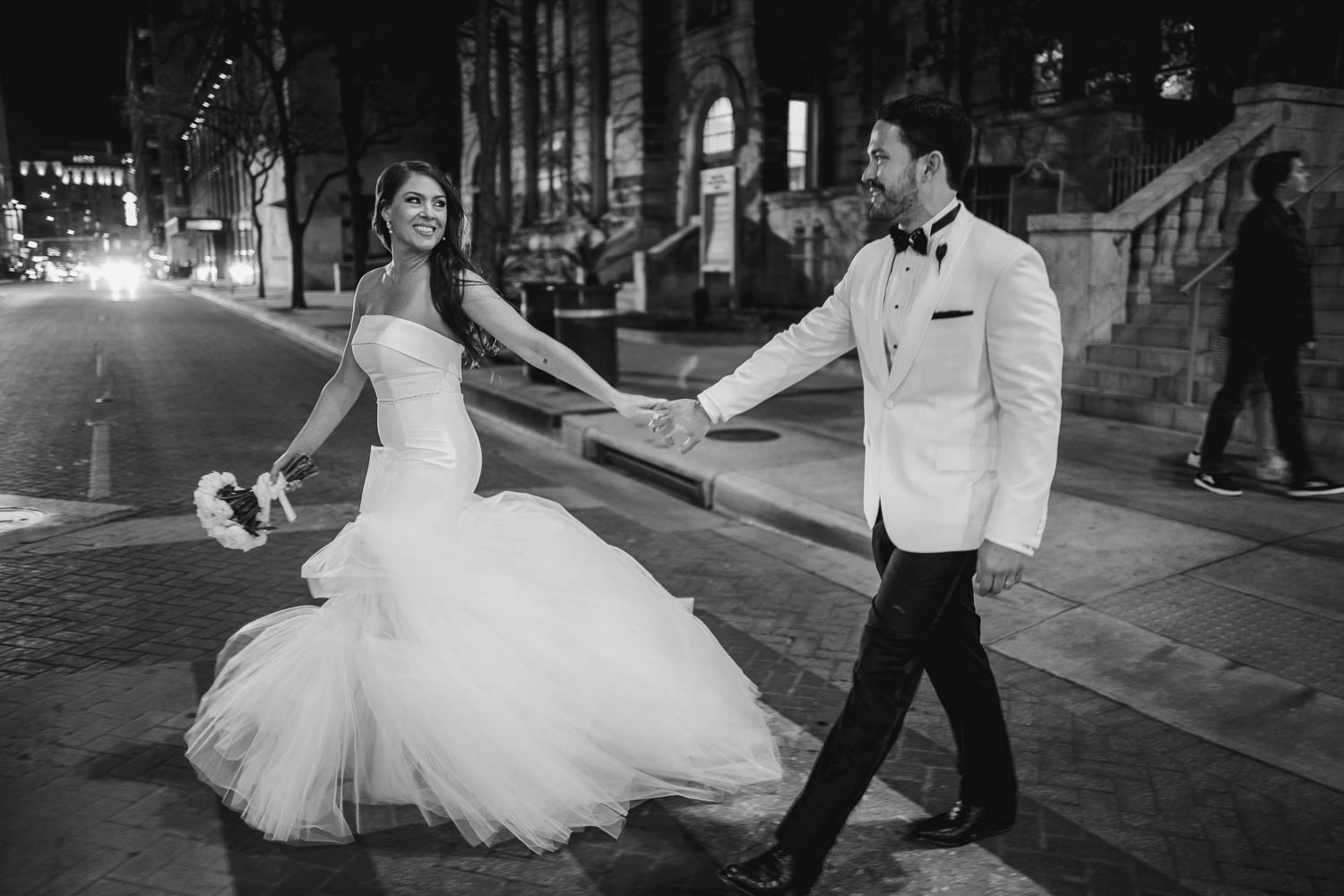 A newly wedded couple cross the street downtown at The St Anthony Hotel, San Antonio Texas L1060214