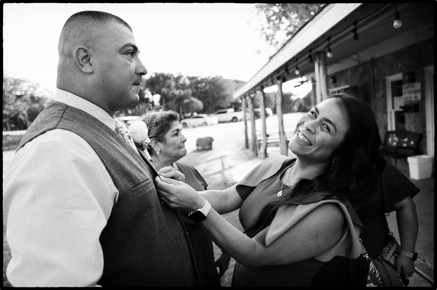 the groom and his sister smiling