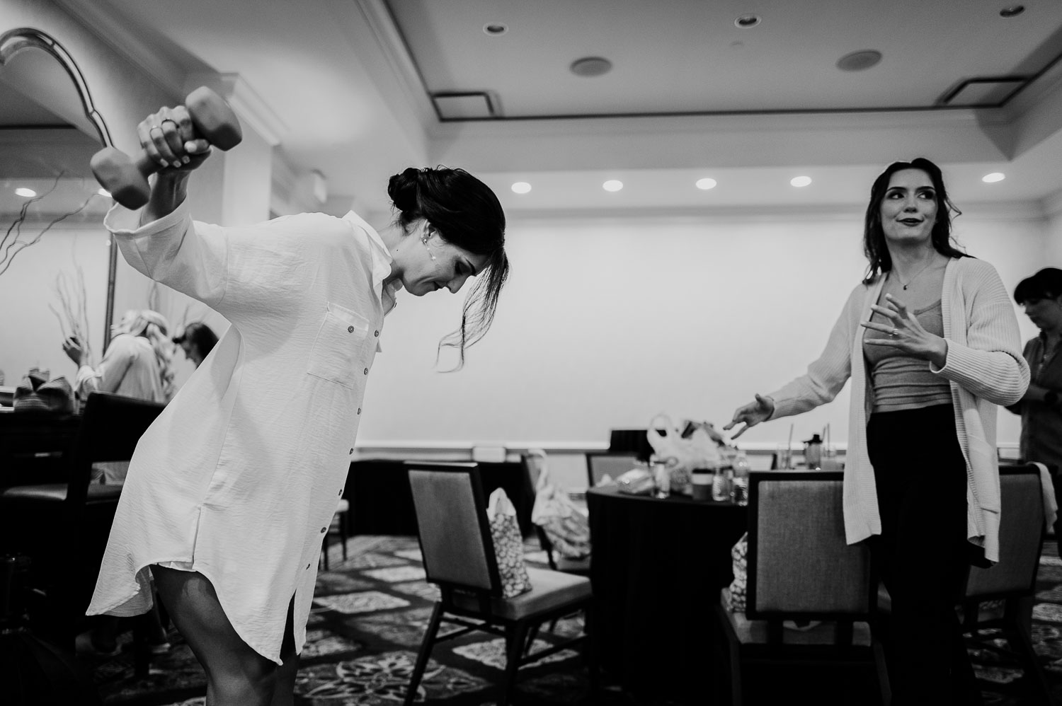 Wedding Ceremony St. Joseph's + The Westin Riverwalk, San Antonio 7 a woman holding a dumbbell in a room