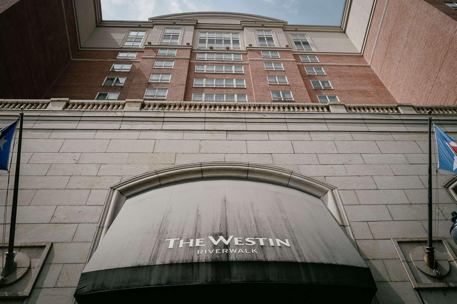Wedding Ceremony St. Joseph's + The Westin Riverwalk, San Antonio 8 a building with a black awning