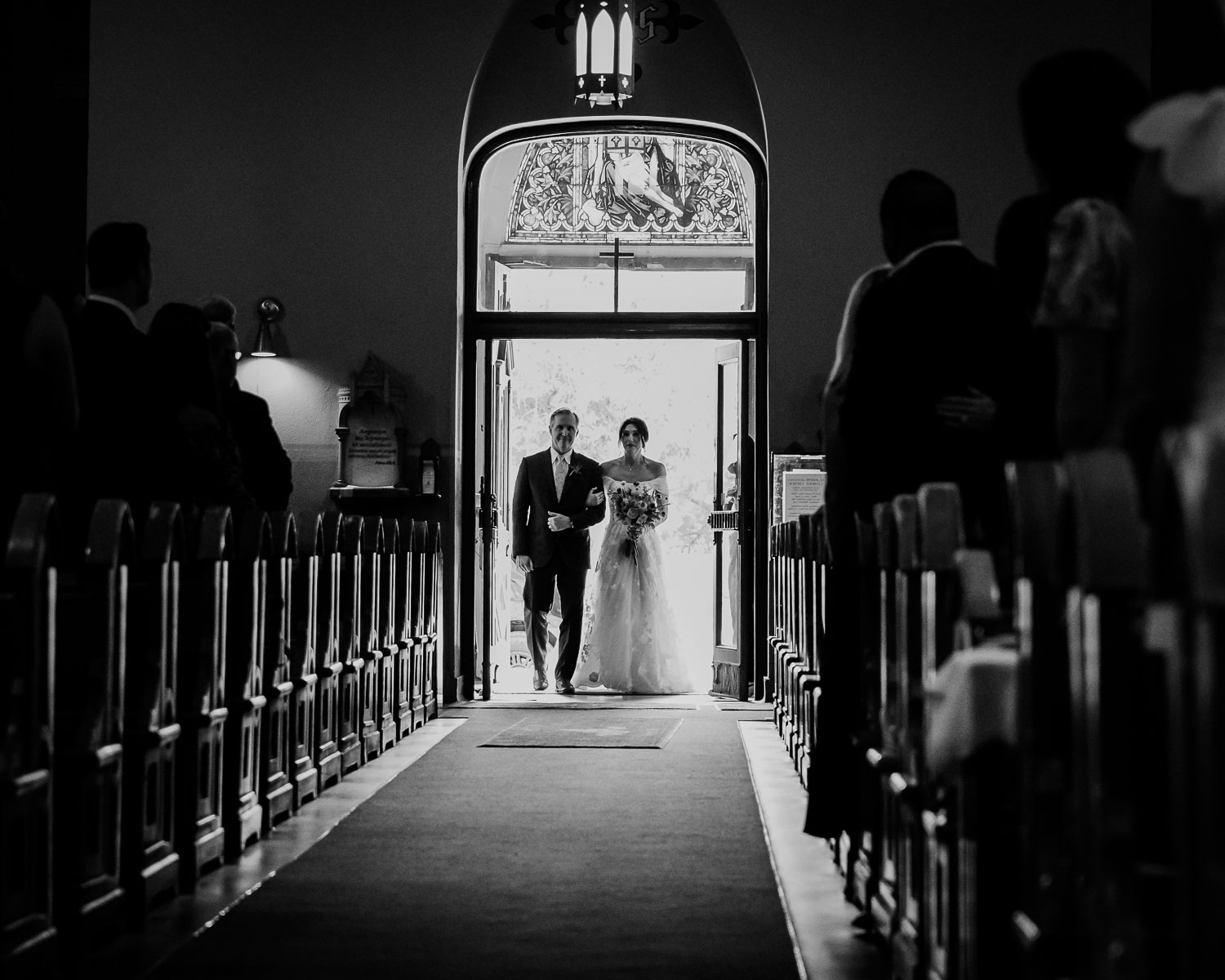 Wedding Ceremony St. Joseph's + The Westin Riverwalk, San Antonio 23 a bride and groom walking down a aisle at St. Joseph's