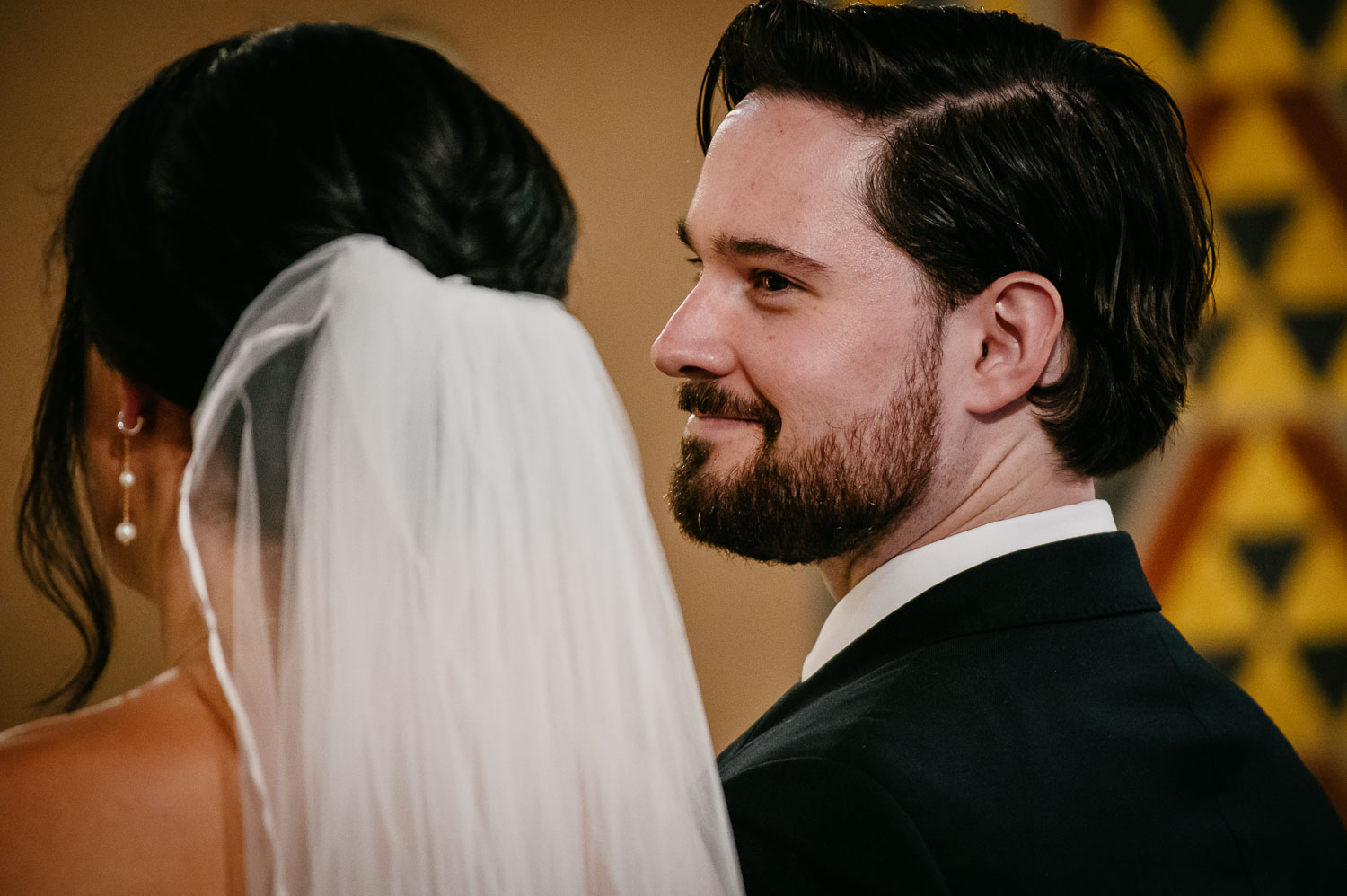 Wedding Ceremony St. Joseph's + The Westin Riverwalk, San Antonio 28 a groom smiles toward his bride in a white veil