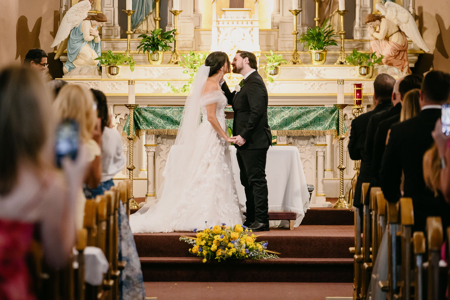 Wedding Ceremony St. Joseph's + The Westin Riverwalk, San Antonio 32 a bride and groom kissing in a church