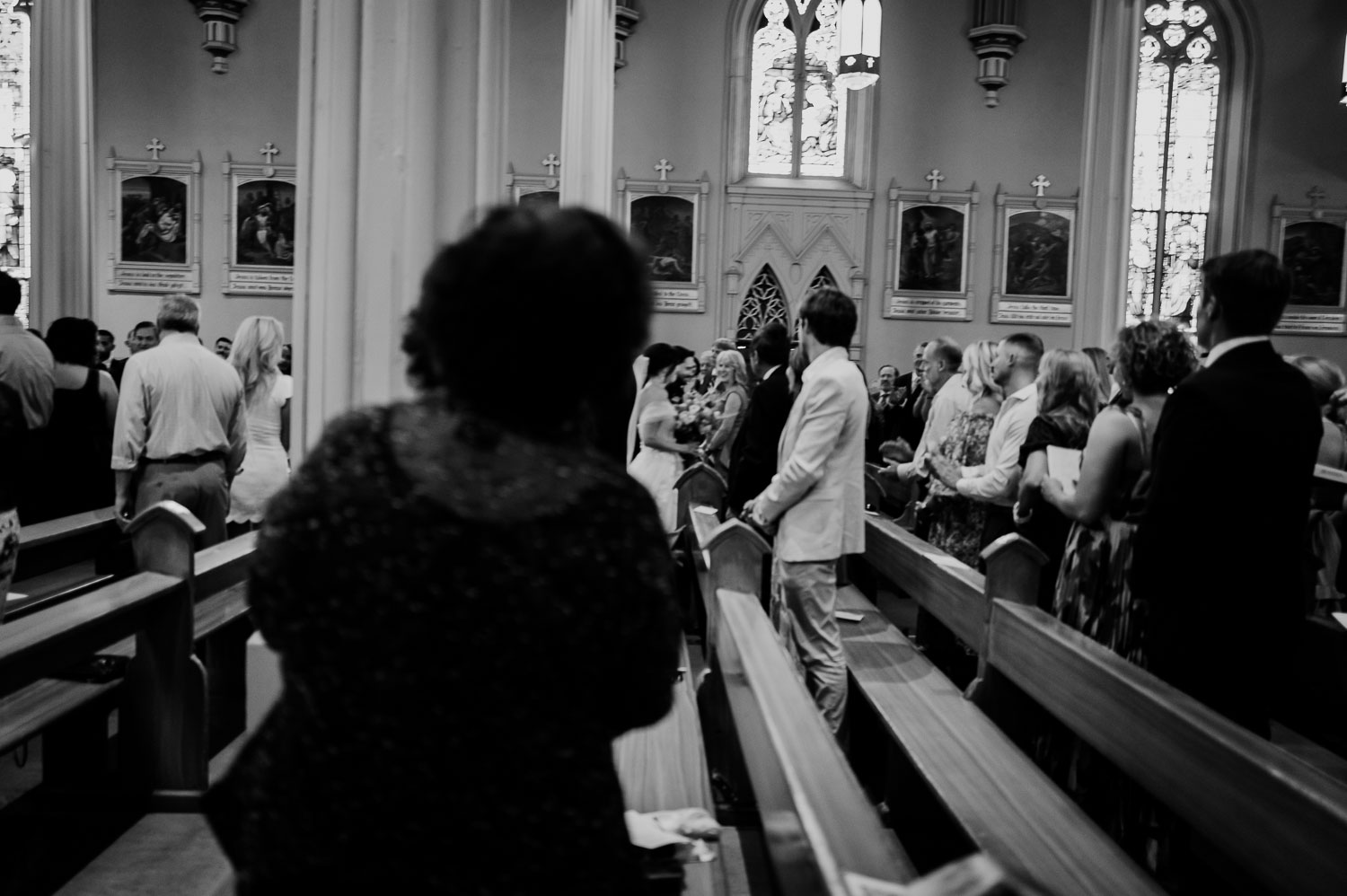 Wedding Ceremony St. Joseph's + The Westin Riverwalk, San Antonio 33 people in a church clapping toward the couple