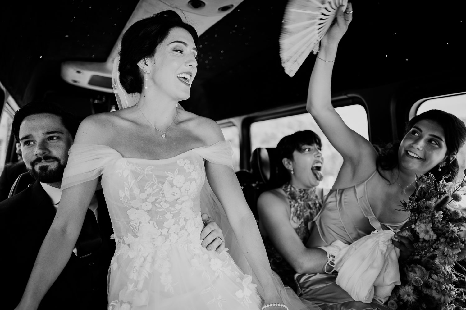 Wedding Ceremony St. Joseph's + The Westin Riverwalk, San Antonio 36 a group of women in a car with the groom looking out