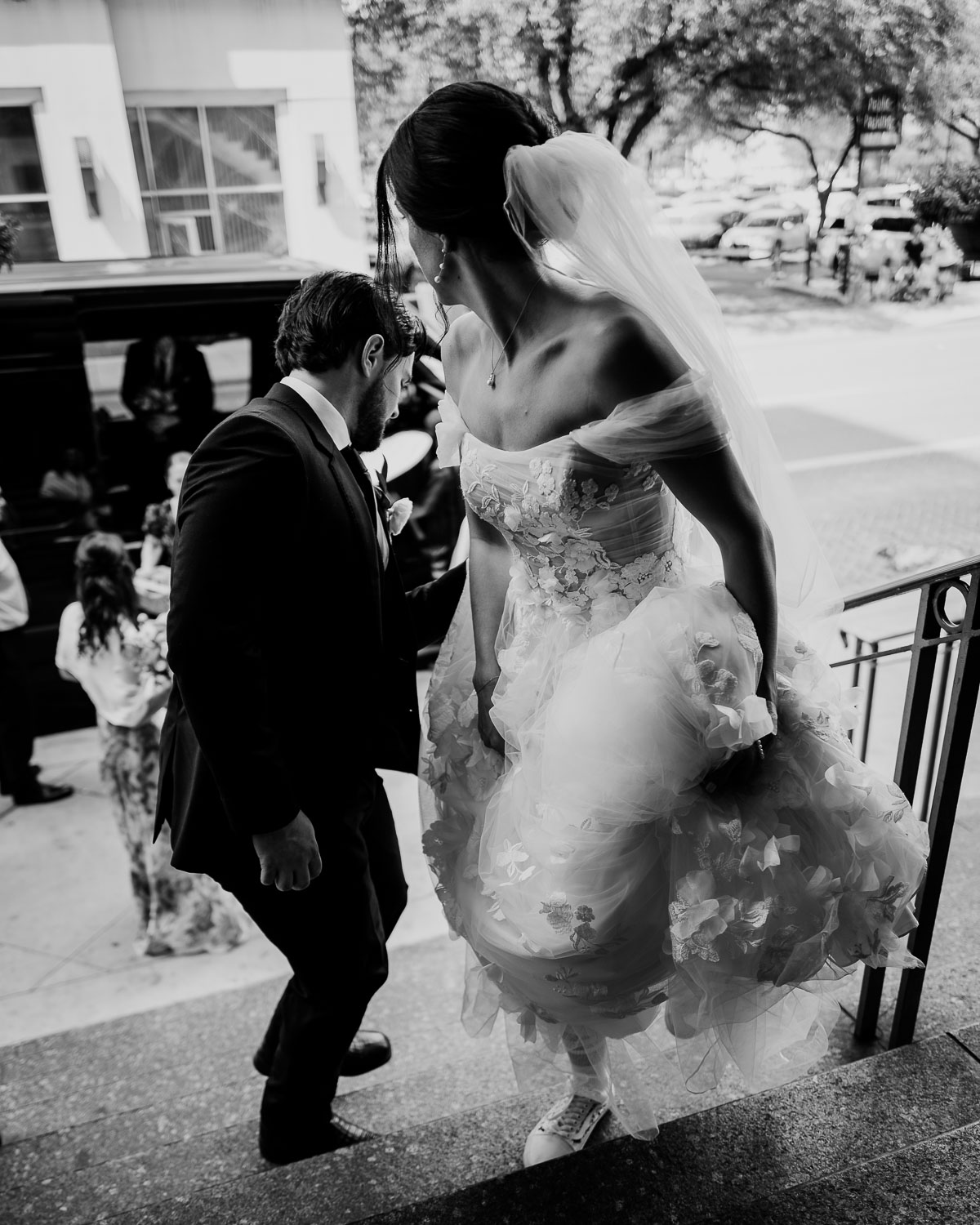Wedding Ceremony St. Joseph's + The Westin Riverwalk, San Antonio 38 a man in a suit and a woman in a wedding dress arrive at the Westin Riverwalk