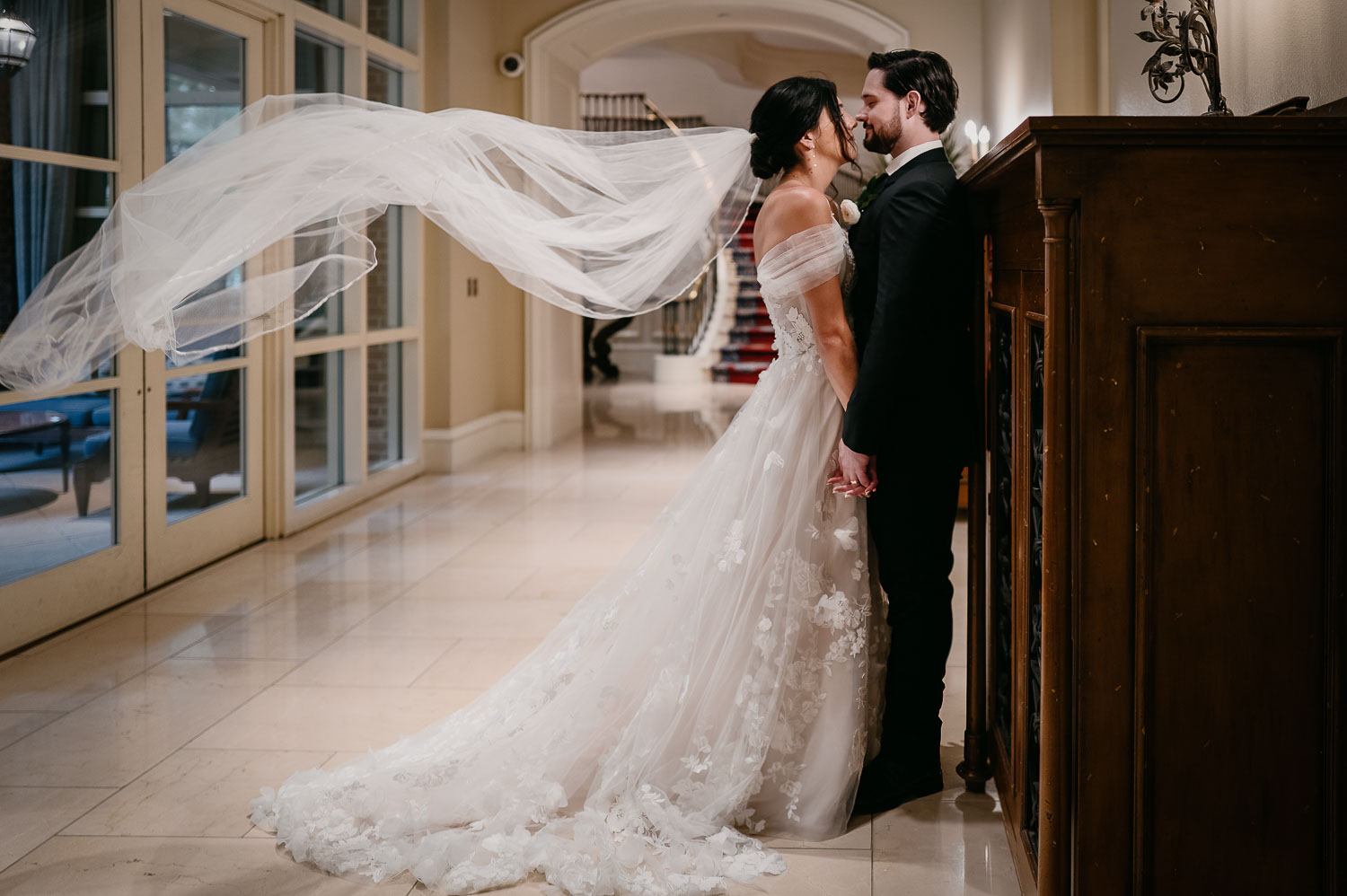 Wedding Ceremony St. Joseph's + The Westin Riverwalk, San Antonio 39 a man and woman in a wedding dress kissing in the Westin Riverwalk hotel