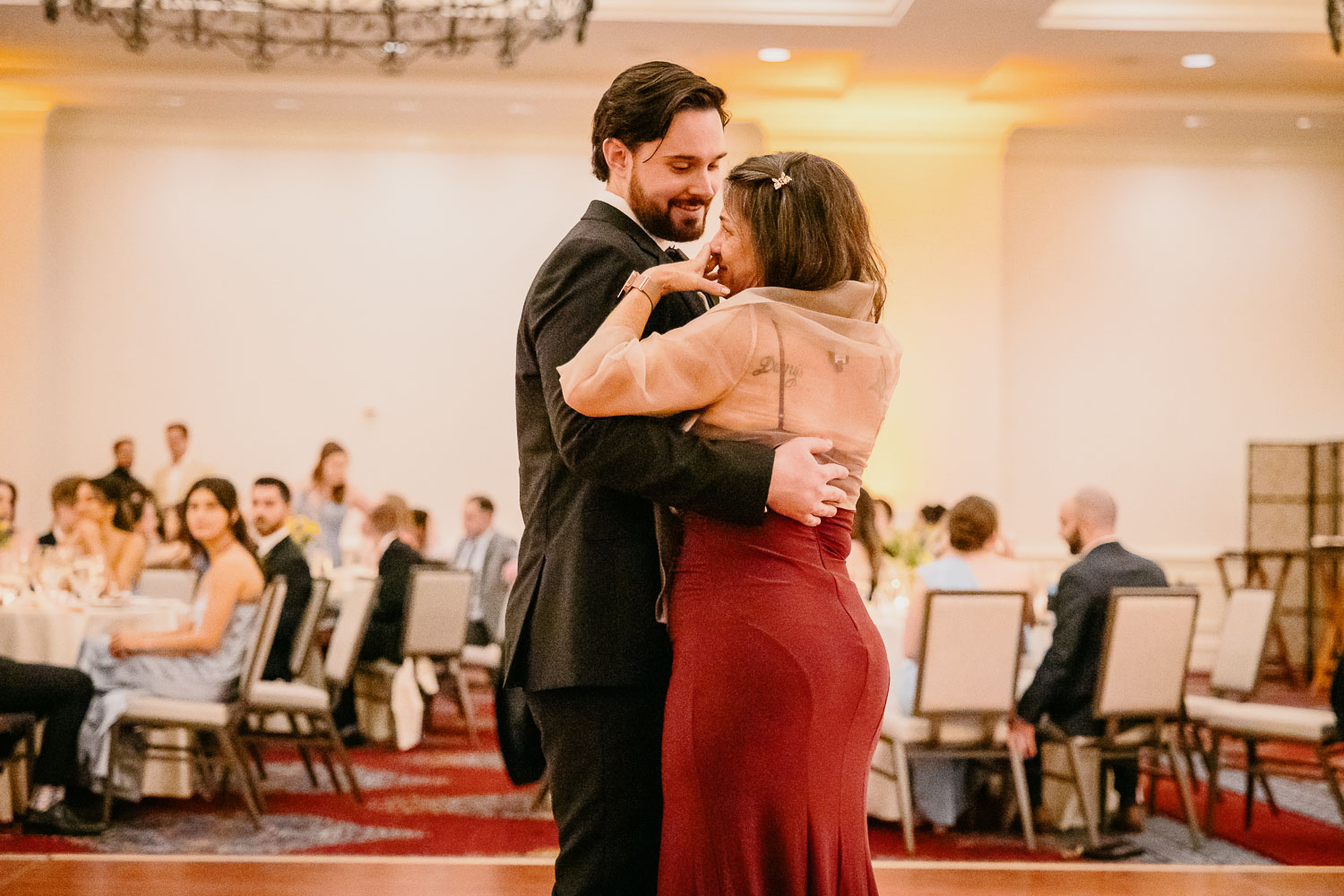 Wedding Ceremony St. Joseph's + The Westin Riverwalk, San Antonio 60 a man and woman dancing in a room with tables and chairs