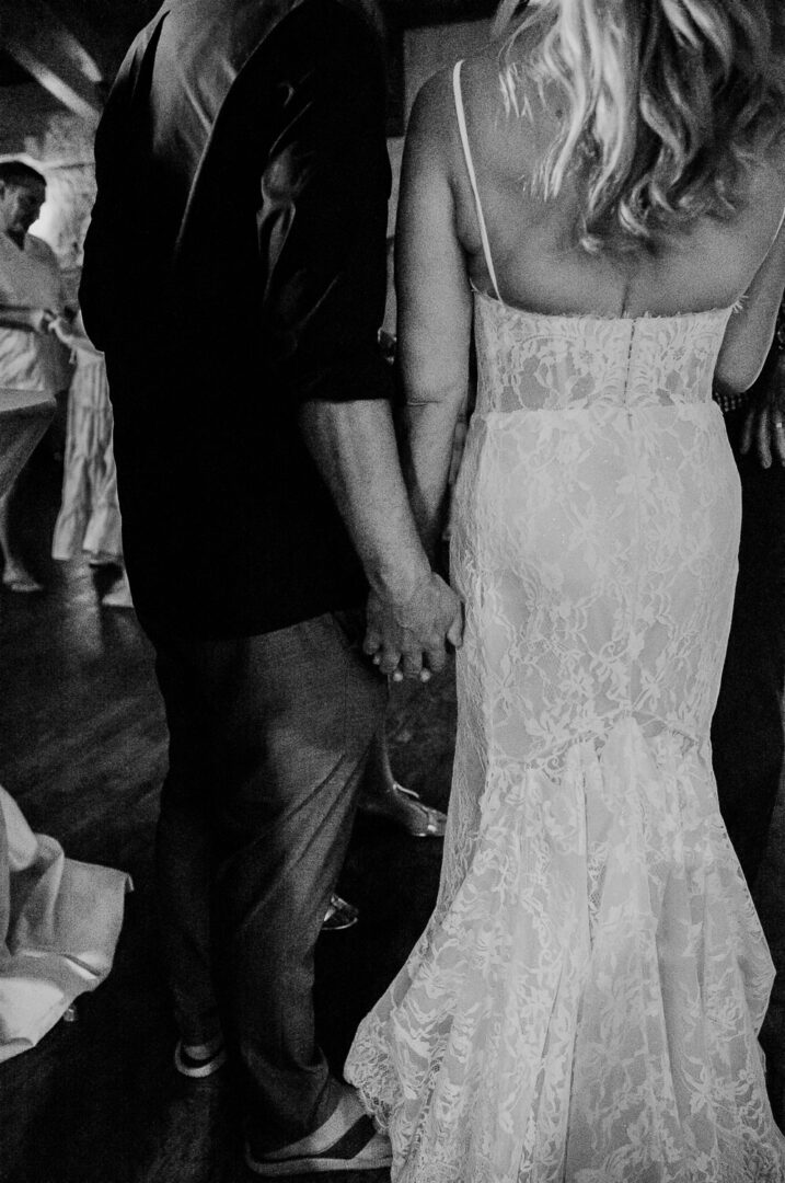 a man and woman holding hands