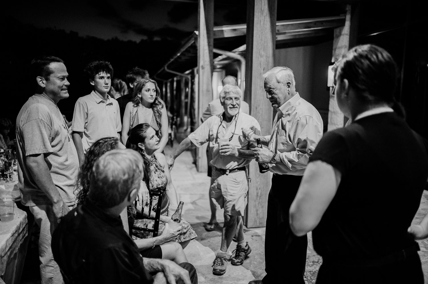 a group of people standing around each other