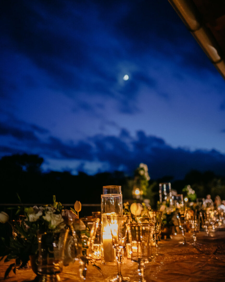 a table with candles and flowers