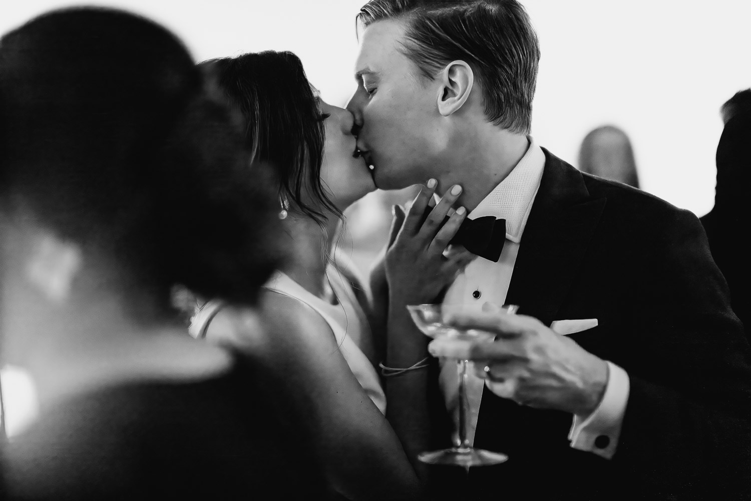 Newly minted couple kiss during wedding reception in San Antono Texas LM109610