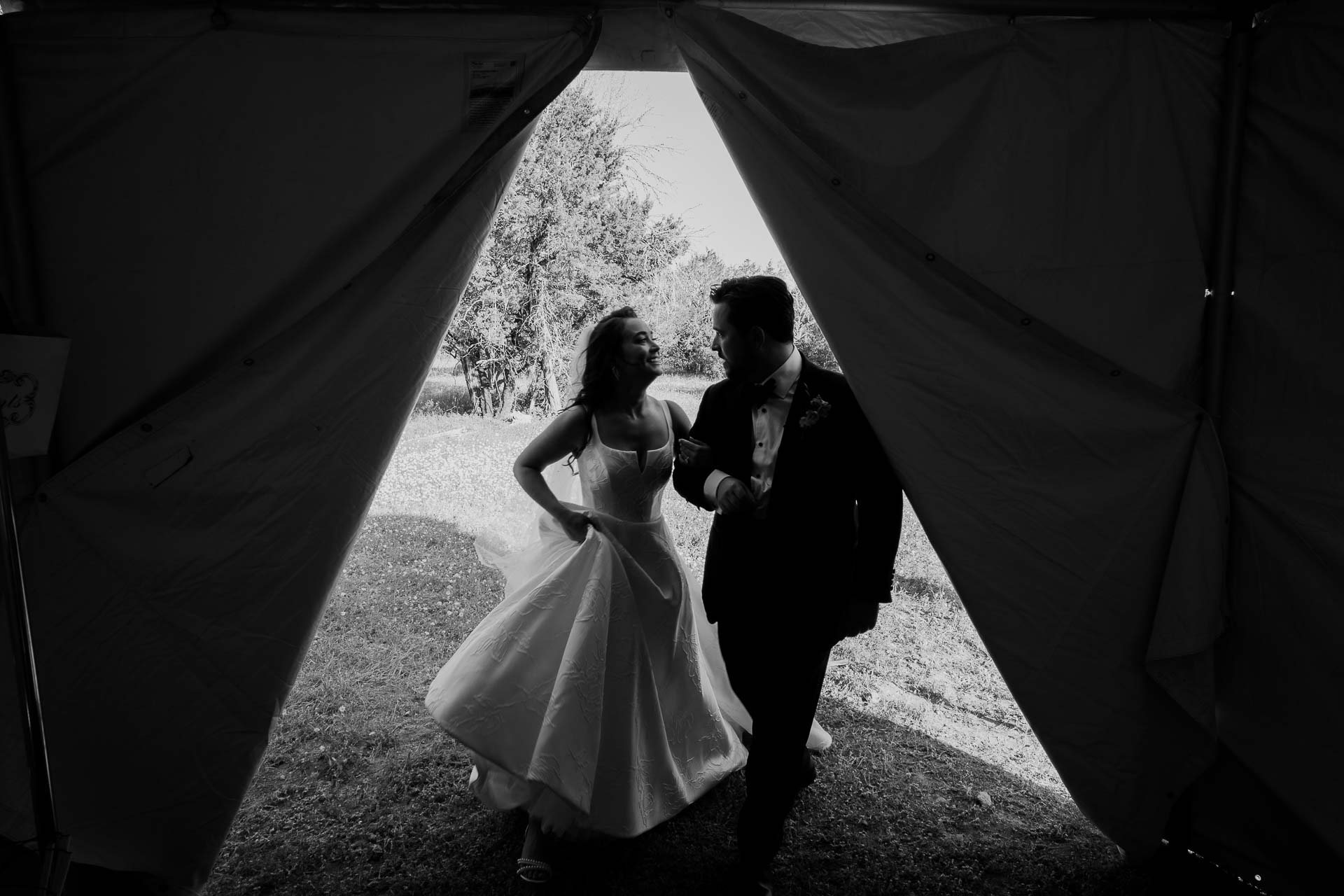 Why I Use the Leica M for Weddings 2 a man and woman in a wedding dress enter a holding area tent - 052 Kendalia Hill Country Wedding Ceremony + Reception Philip Thomas Photography