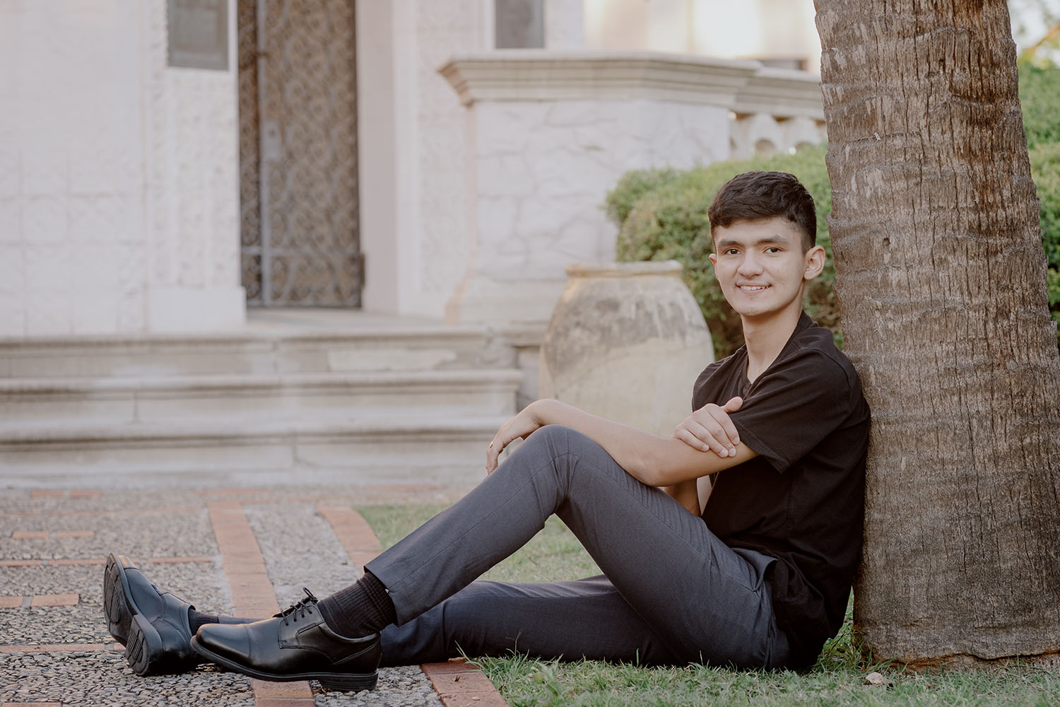 Senior Portraits San Antonio (Gallery) Philip Thomas Photography 23 a senior sitting on the ground leaning against a tree