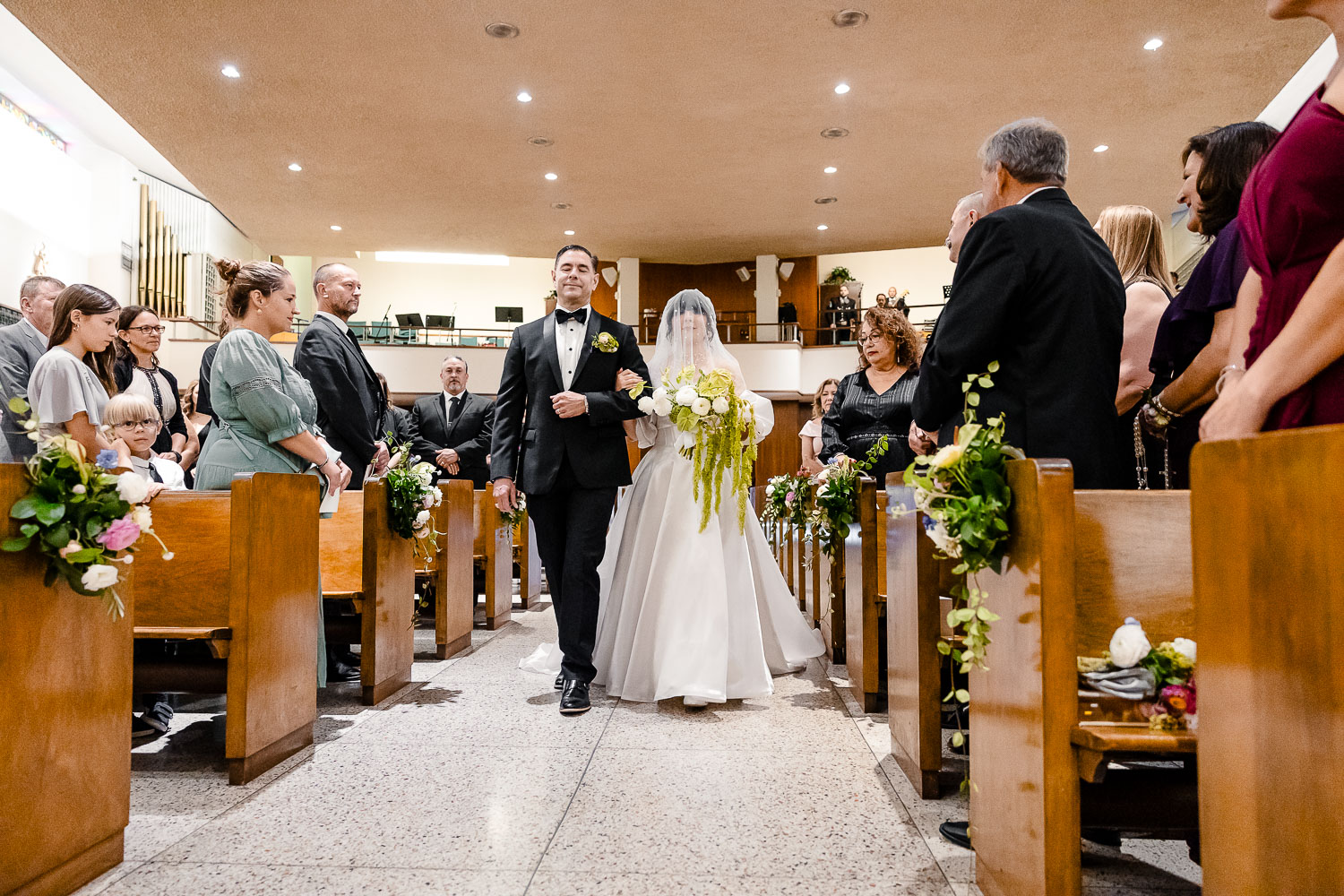 St. Patrick Catholic Church | Art Museum of South Texas Corpus Christi 19 a man and woman walking down the aisle