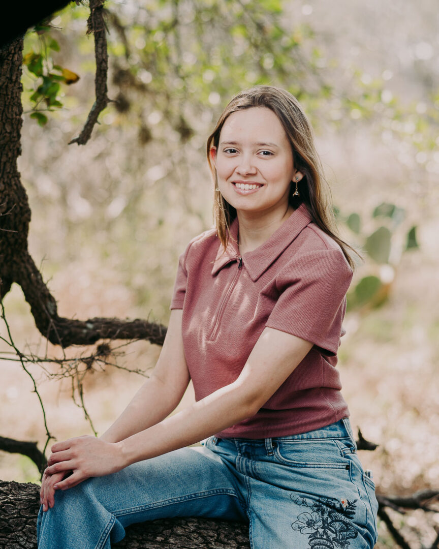 Senior Portraits San Antonio (Gallery) Philip Thomas Photography 9 a senior sitting on a tree stump