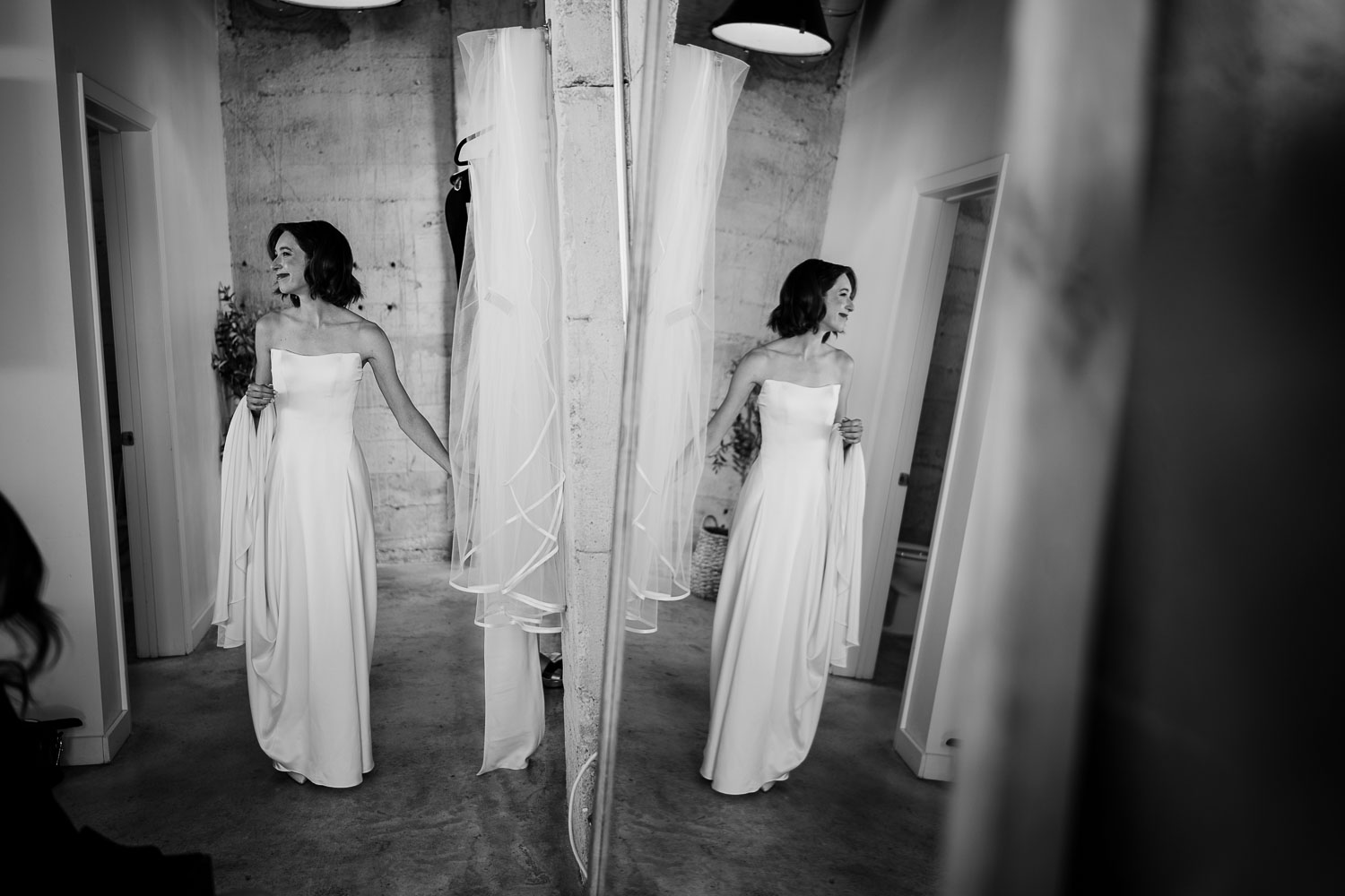 Ice Plant Bldg Wedding | La Grange | Zoe+Patrick 7 Bride preparing in elegant white dress.