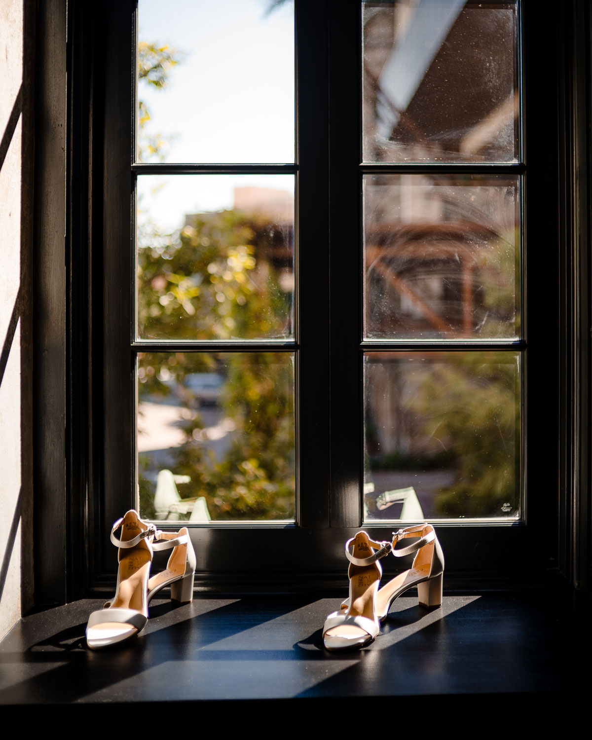Botanical Gardens San Antonio Wedding Ceremony + Reception 8 Elegant shoes on a sunlit windowsill.