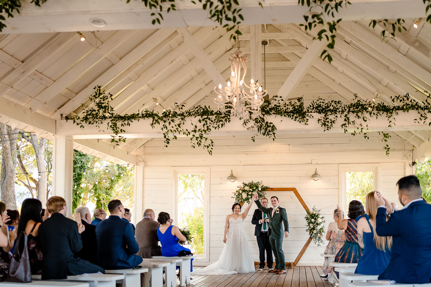 Wedding ceremony in a decorated chapel.